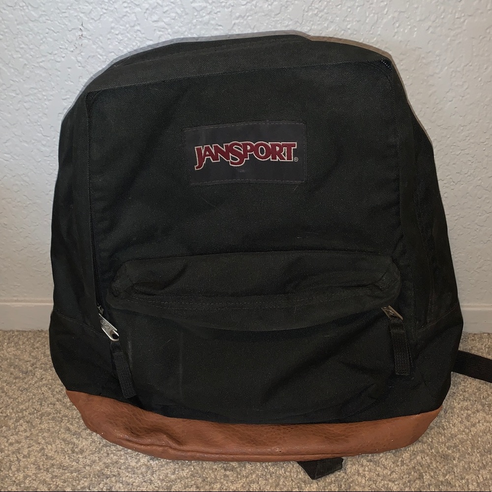Black and leather Jansport backpack